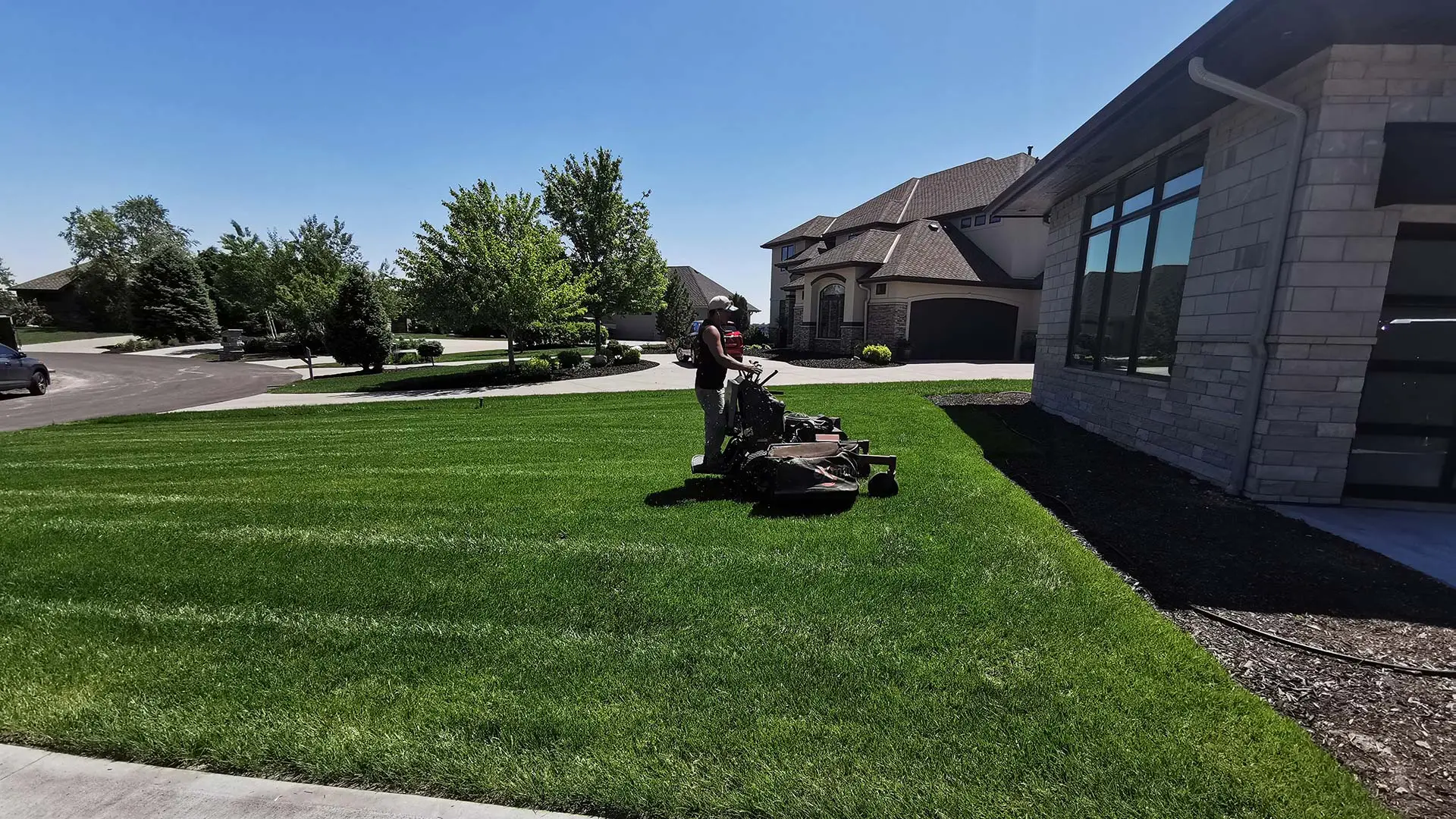 Our landscaper mowing a lawn in Omaha, NE.