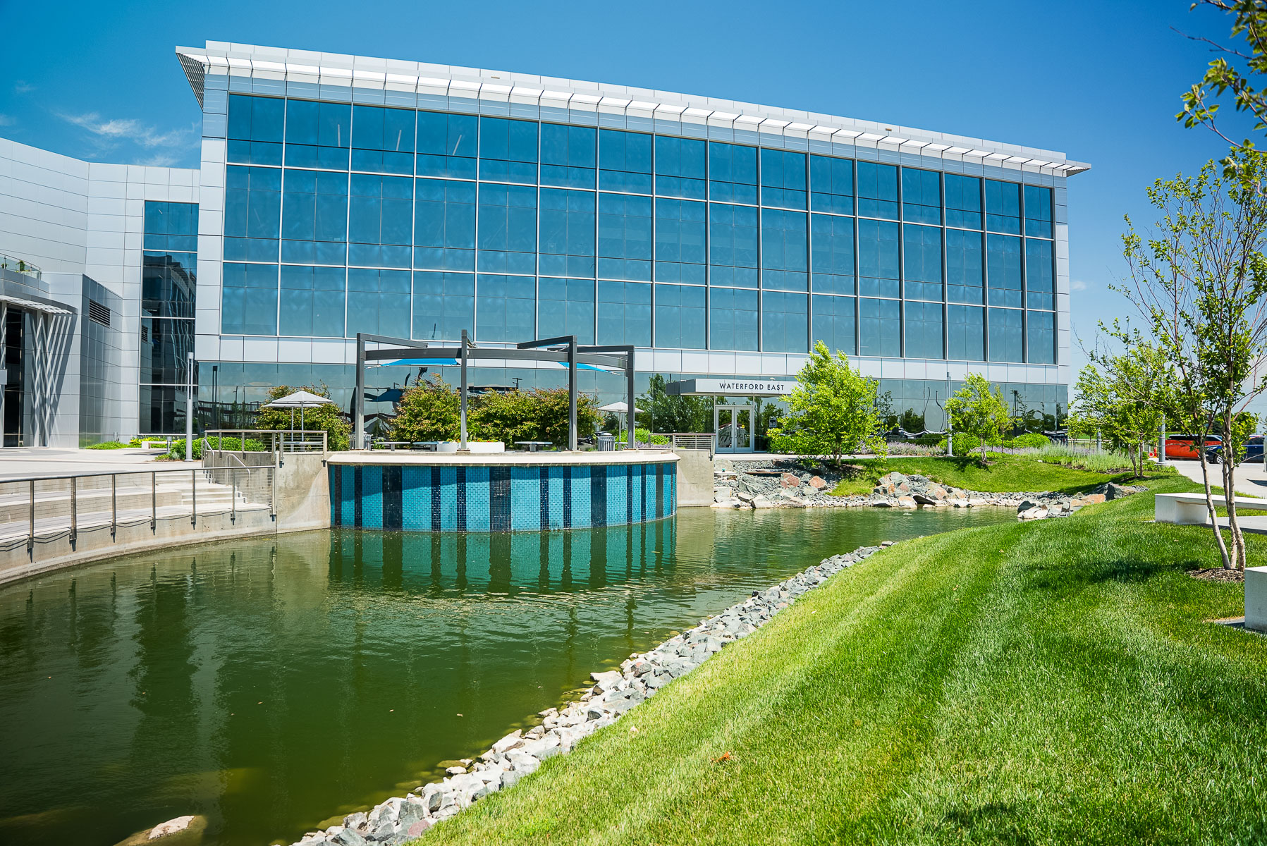 commercial landscape water feature retention pond grass building