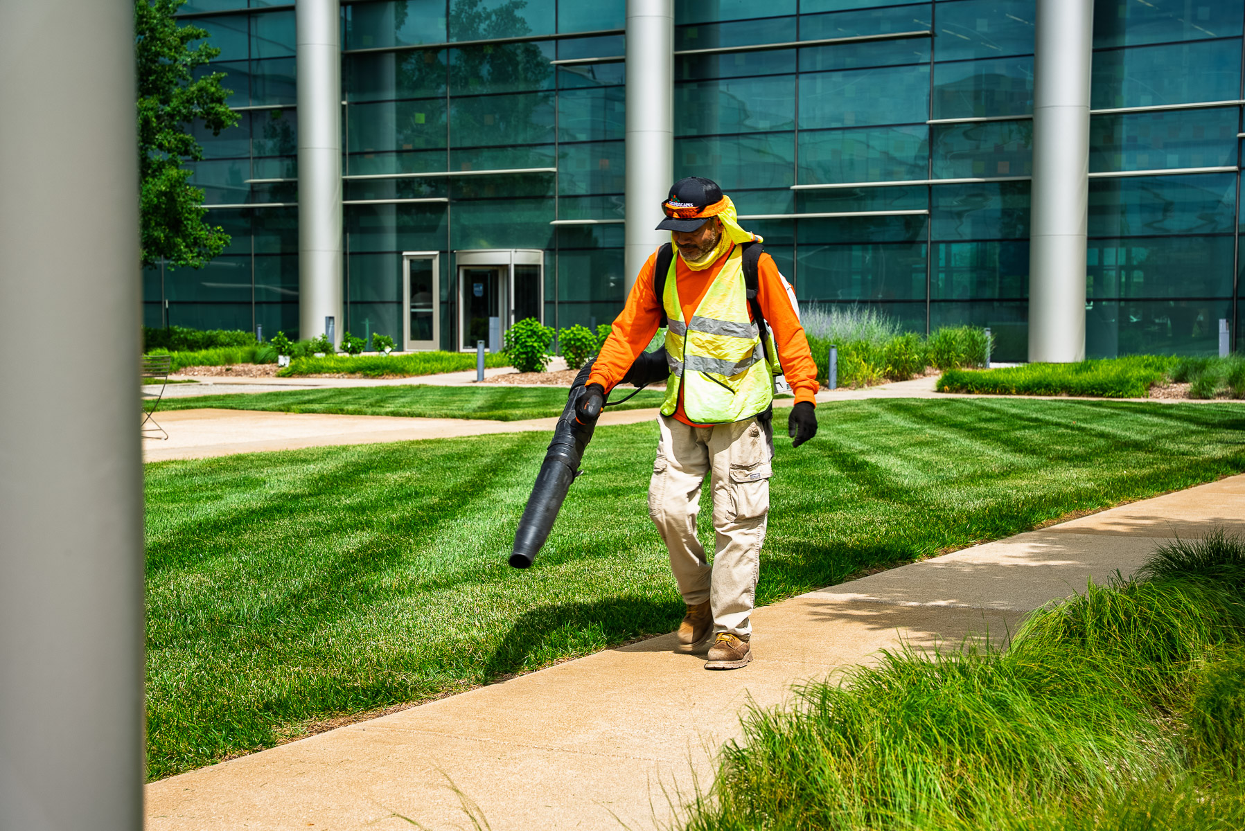 commercial maintenance crew backpack blower clean debris lawn 5