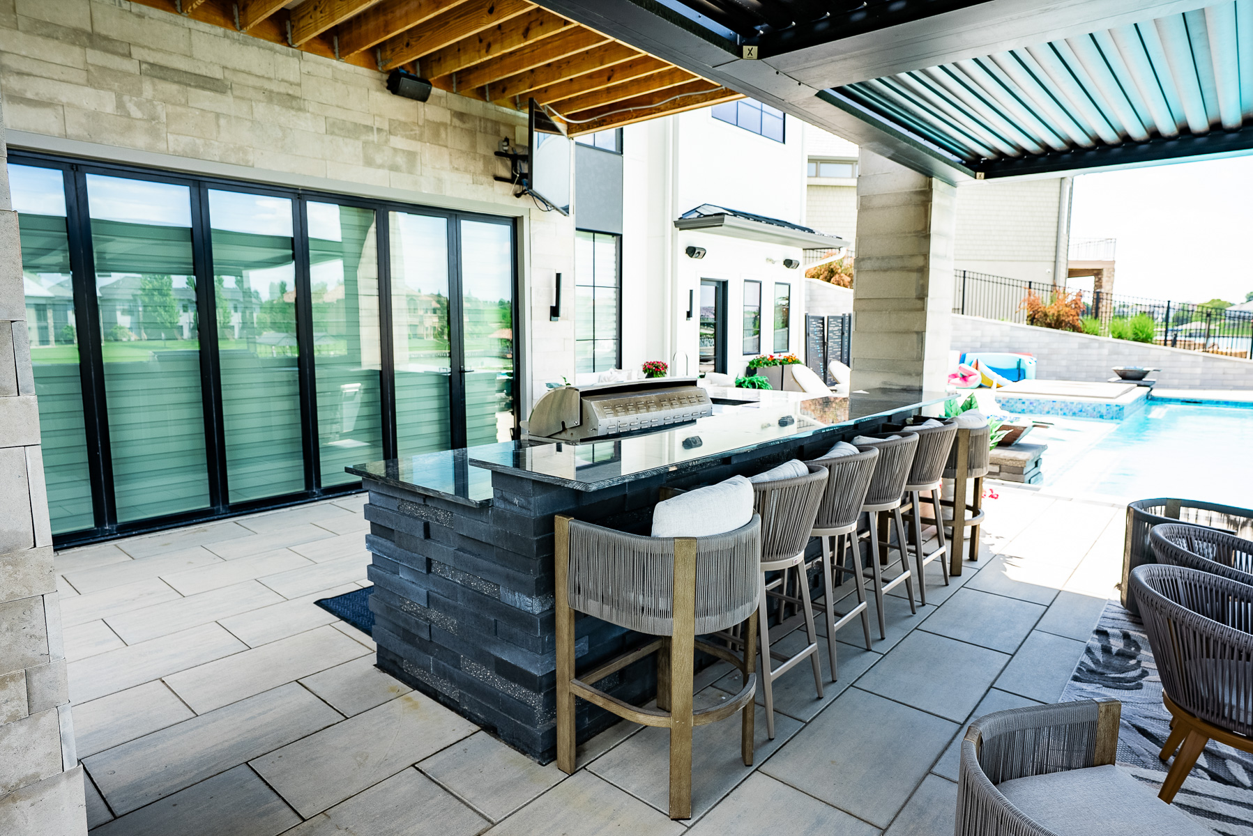 outdoor kitchen grill stone counter pergola stone patio tv 2
