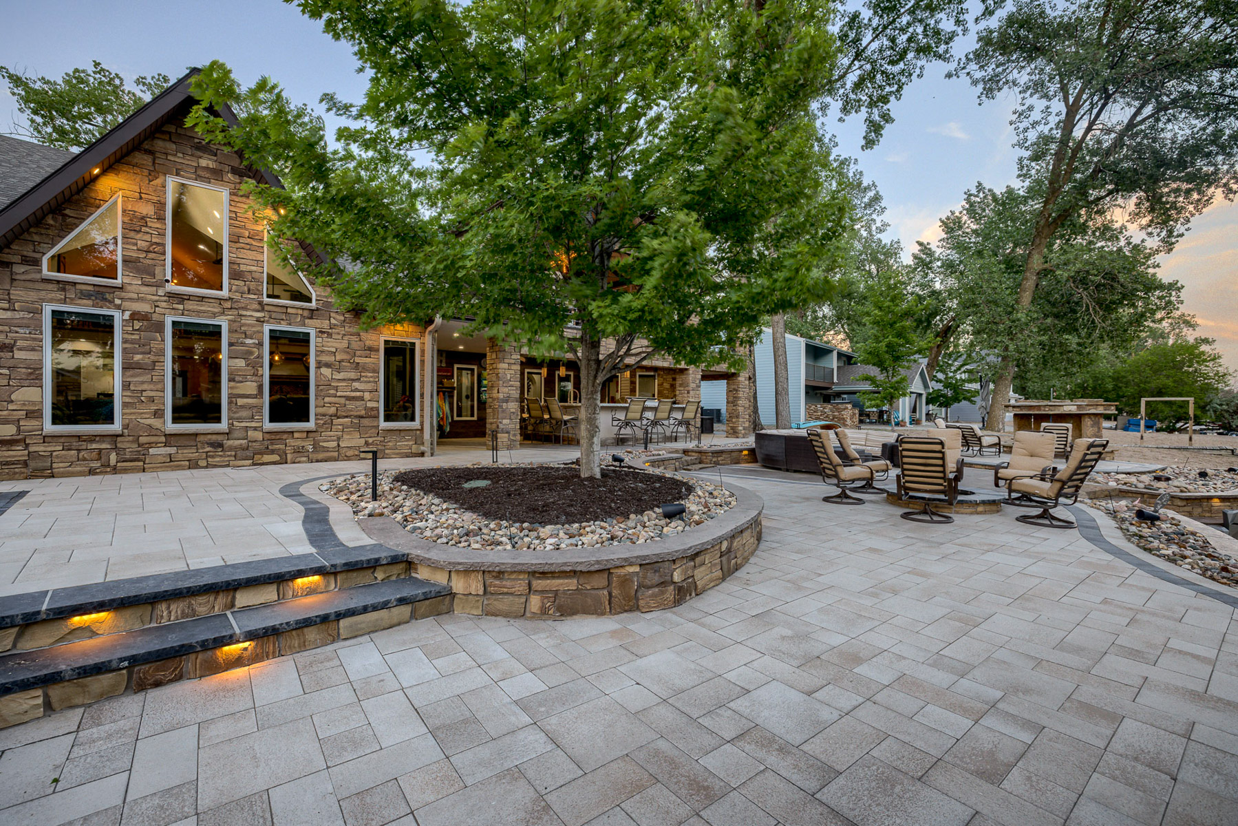patio stone paver steps lights seating backyard hardscape