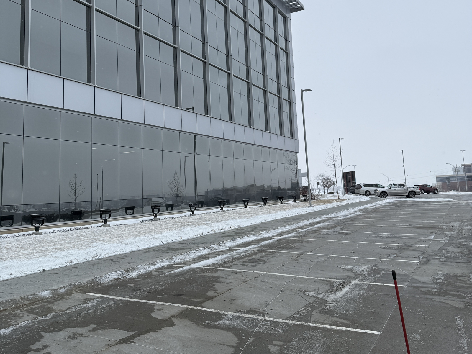 snow commercial property parking spots clear sidewalks